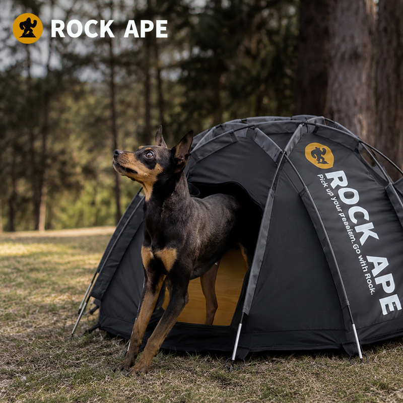 Dog standing beside the Rock Ape pet tent outdoors